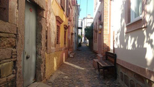 Narrow alley amidst buildings in town