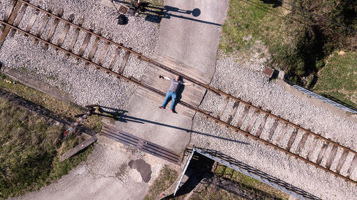 High angle view of man walking on staircase
