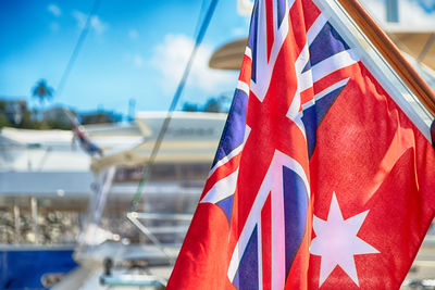 Close-up of flag against blue sky