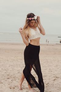 Woman standing on beach