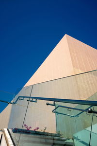 Low angle view of building against blue sky