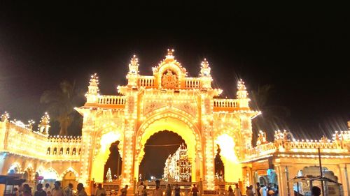 Low angle view of illuminated building at night