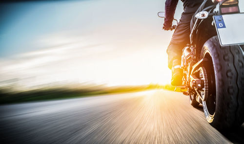 Low angle view of person riding motorcycle