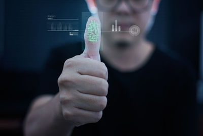 Man scanning thumb on scanner