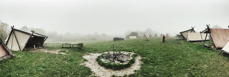 Panoramic view of field against sky