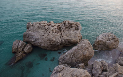 High angle view of rocks in sea
