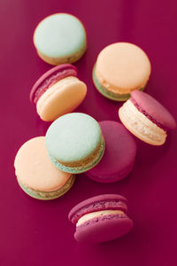 Close-up of macaroons against yellow background