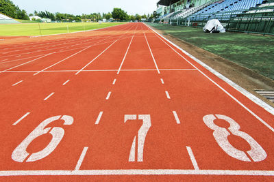 Close-up of numbers on running track