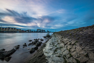 Scenic view of bay against sky