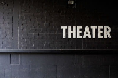 Theater text on black wall