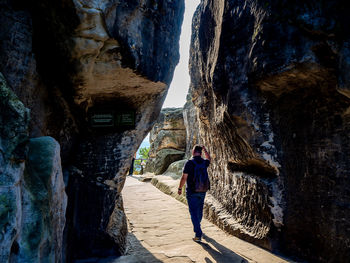 Rear view of man walking on mountain