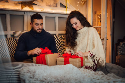 Young couple sitting in box