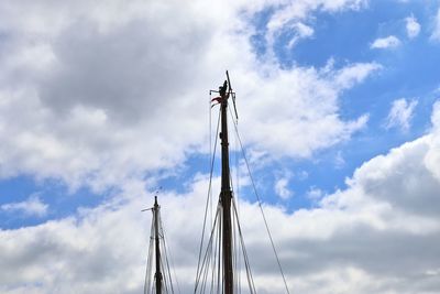 Low angle view of crane against sky