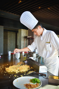 Man preparing food at restaurant