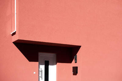 Low angle view of building against orange sky