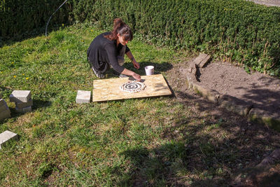 High angle view of man sitting on field