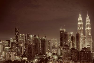 View of skyscrapers lit up at night