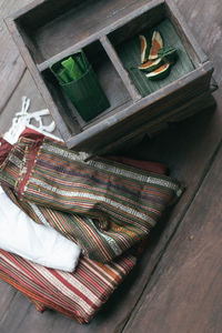 High angle view of open window on wooden table