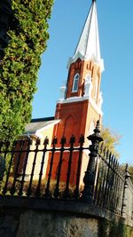 Low angle view of clock tower against sky