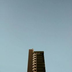 Low angle view of built structure against clear blue sky