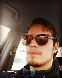 Portrait of young man wearing sunglasses