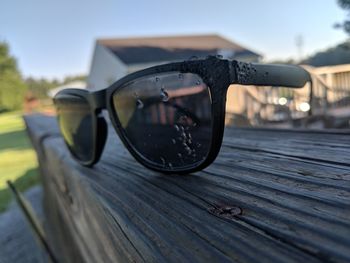 Close-up of sunglasses on table outdoors