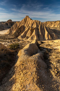 Scenic view of arid landscape against sky. bardenas reales. spain