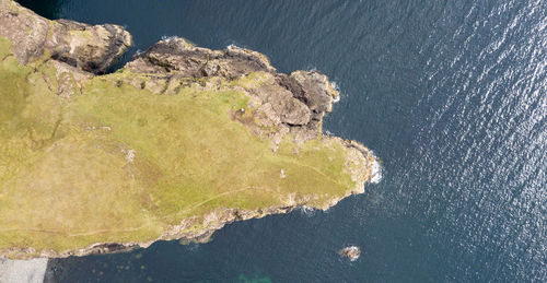 High angle view of rock formations on sea shore