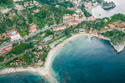 High angle view of buildings by sea