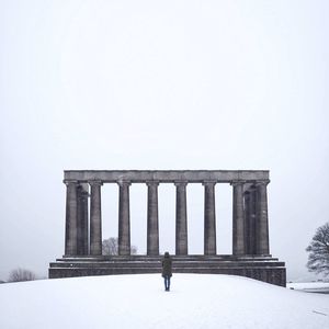 Low angle view of historical building against sky during winter