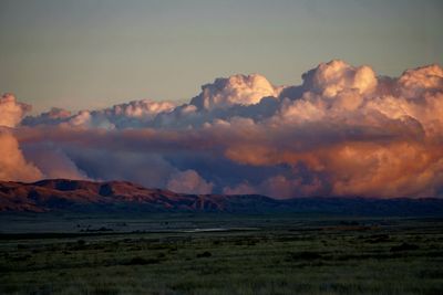 Scenic view of landscape against sky during sunset