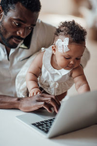 Mother and daughter using mobile phone