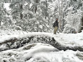 Man on snow covered landscape