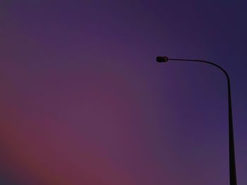 Low angle view of street light against sky