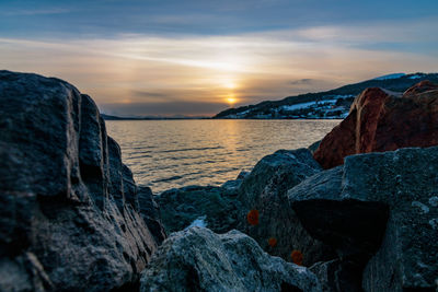 Scenic view of sea against sky during sunset