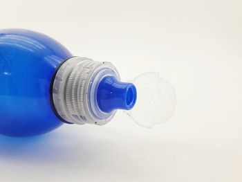 Close-up of light bulb against white background