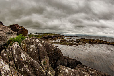 Scenic view of mountain against cloudy sky