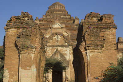 Low angle view of old ruin building against sky