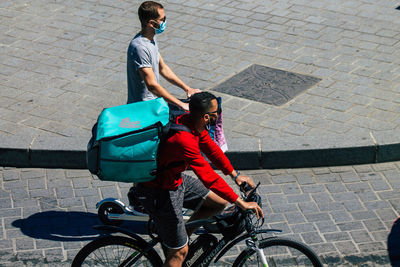 High angle view of man riding bicycle on street