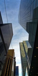 Low angle view of modern buildings against sky