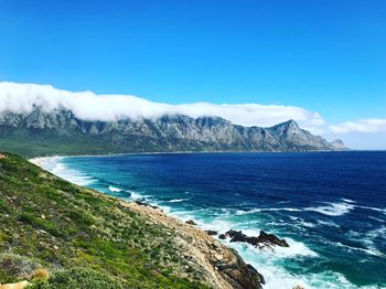 Scenic view of sea against blue sky