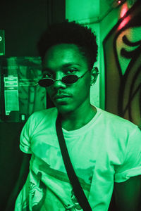 Portrait of young man standing outdoors