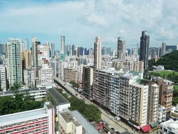 High angle view of buildings in city against sky