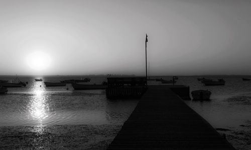 Pier over sea against clear sky