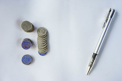 High angle view of coins on table