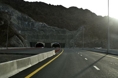 Car on road against mountain range