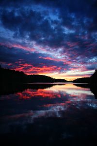 Scenic view of lake against romantic sky at sunset