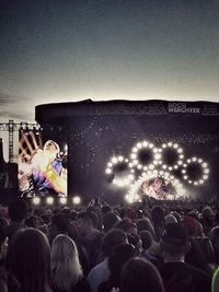 People enjoying music concert