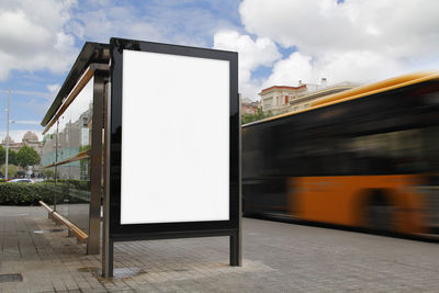 Blurred motion of road against sky in city