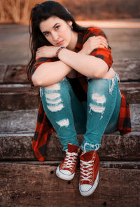 Portrait of a smiling young woman standing outdoors